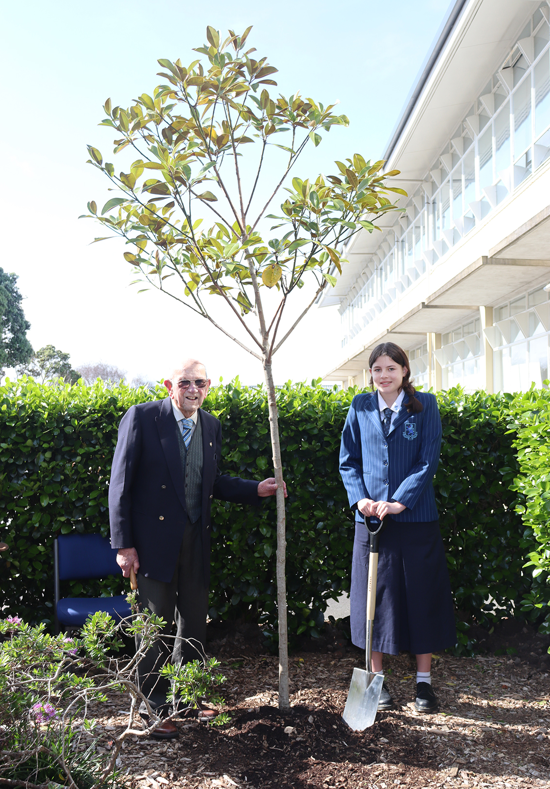 Professor Russell Stone and Year 12 student Jessica Lamb conduct the ceremonial planting of the Centenary Tree.